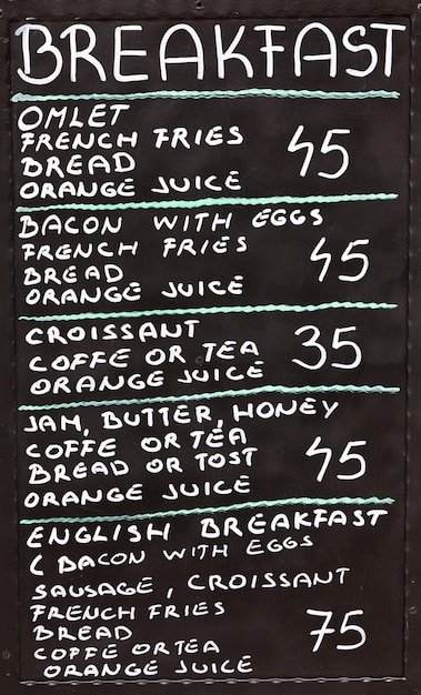 Street cafe breakfast menu written in chalk on a blackboard