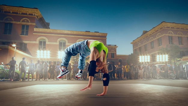 Street dancer girl dance breakdance on evening street