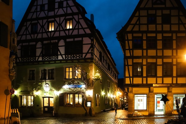 Street decorated for New Year and Christmas Market in Rothenburg ob der Tauber Bavaria Germany December 22 2022