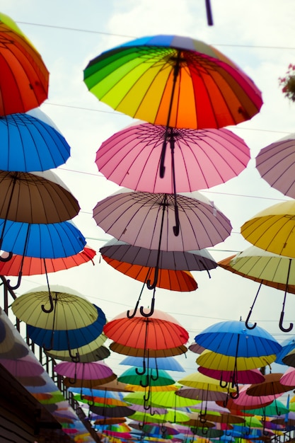 Street  decoration with bright umbrellas against the sky