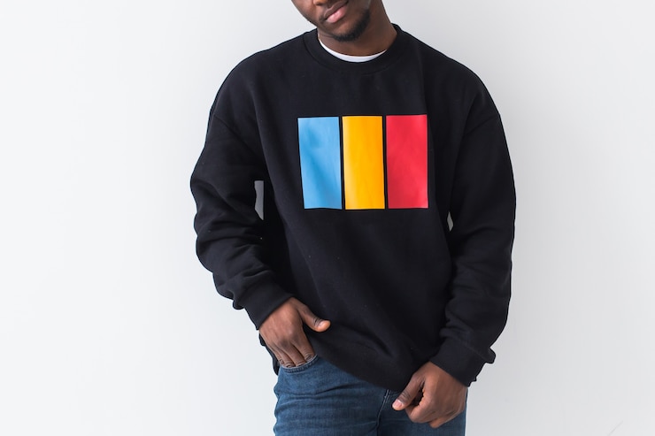 Photo street fashion concept - close-up of young handsome african man wearing sweatshirt against white