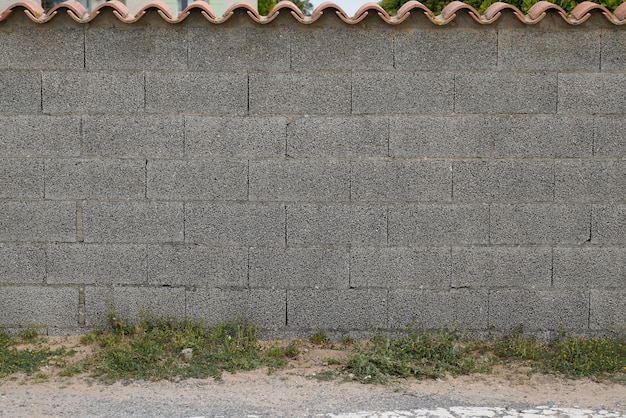 Street gray cement block wall grey background Industrial background empty grunge urban street with warehouse brick