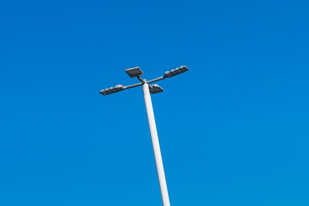 Street lamp against the blue sky