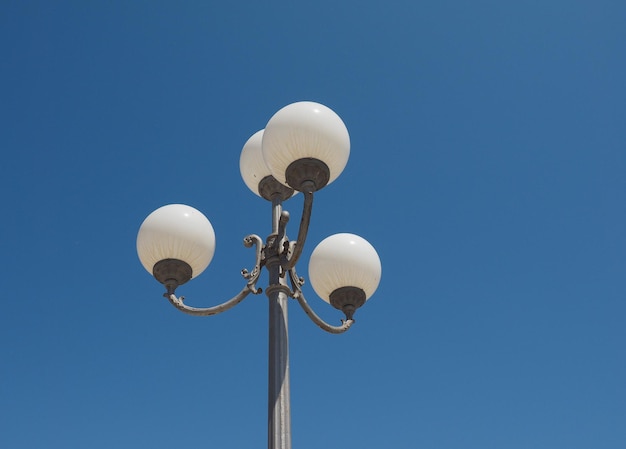 Street lamp over blue sky