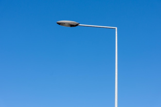 Street lamp on a pole against a beautiful sky