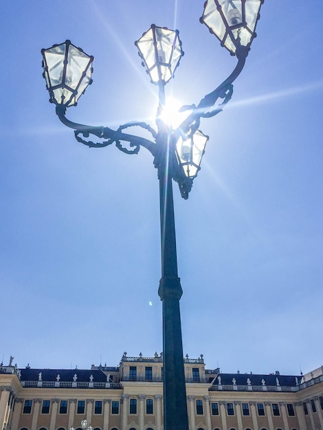 A street lamp with the sun shining on it