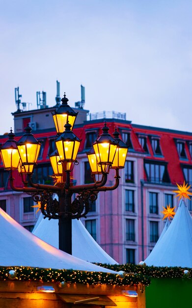 Street Lantern at Christmas Market at Gendarmenmarkt in Winter Berlin, Germany. Light at Advent Fair Decoration and Stalls on the Bazaar. German street Xmas and holiday in European city