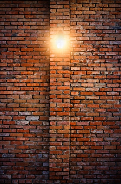 Street light illuminates wall red old burnt brick