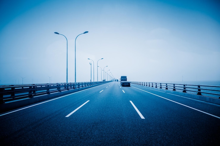 Photo street lights on highway against sky