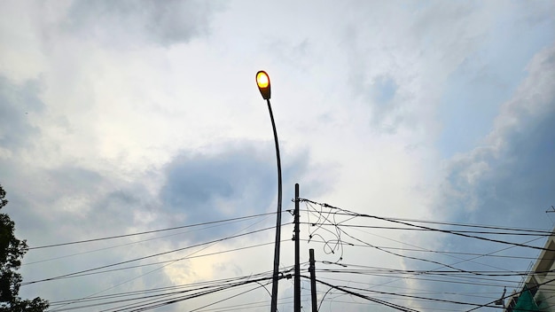 Photo street lights turn on automatically in the afternoon to illuminate