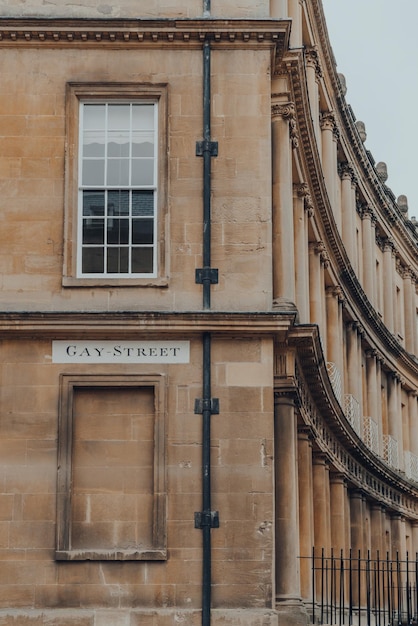 Street name sign on a wall of stone building on gay street in bath somerset uk