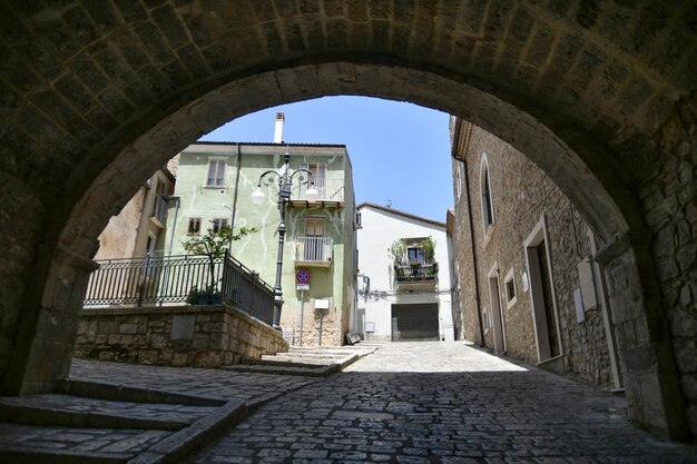 A street between the old houses of Pietragalla a village in the Basilicata Italy