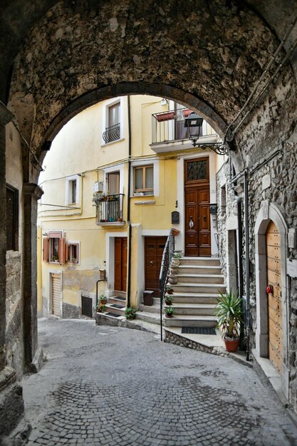 A street between the old stone houses of Pratola Peligna a medieval village in the Abruzzo Italy