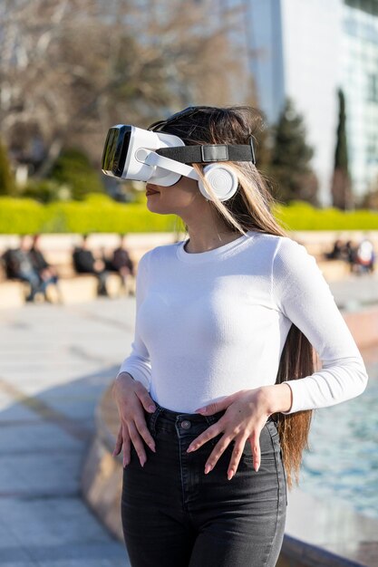 Street photo young lady wears virtual reality glasses High quality photo