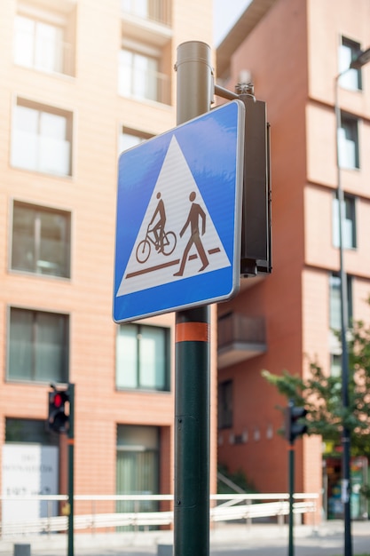 Photo street sign pedestrian and cyclist crossing.