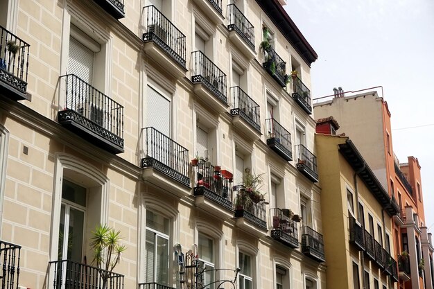 Street view looking up at apartment block in city Madrid. Traditional architecture of Madrid, Spain