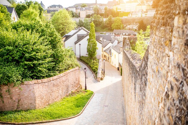 Street view near the castle wall in the old town of Luxembourg during the sunset