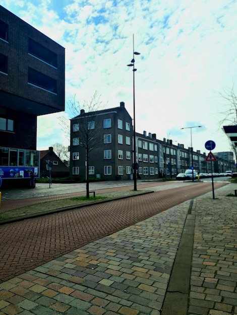 A street with a blue sign that says'no parking'on it