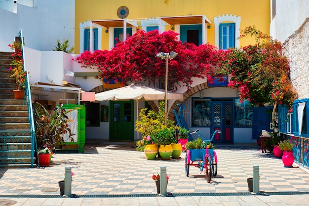 Street with colorful houses in adamantas town on milos island in greece