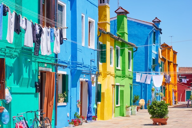 Street with colorful old houses in Burano island in Venice, Italy