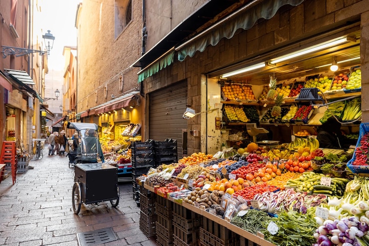 Street with market stalls full of fresh local food in italy