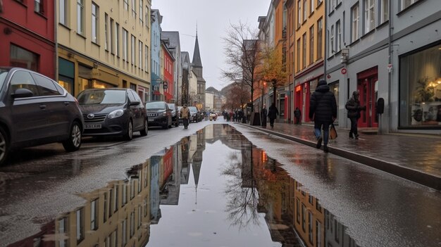 a street with a reflection of a church in the water.