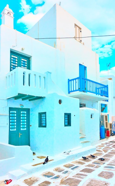 Street with small whitewashed houses in Mykonos town, Greece