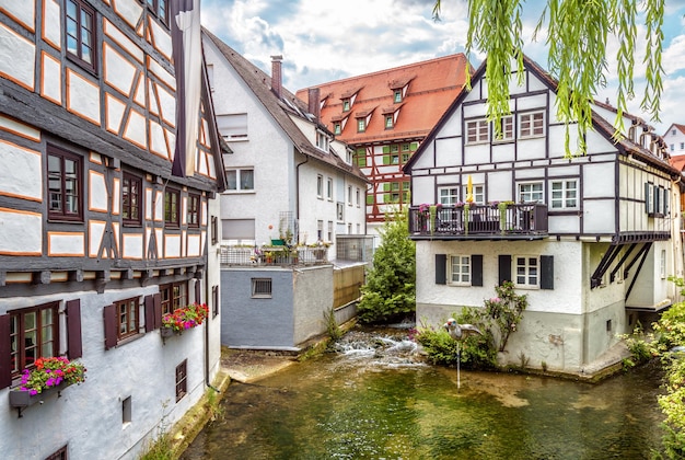 Street with vintage halftimbered houses in old town of Ulm Germany Medieval Fish Quarter is tourist attraction of Ulm