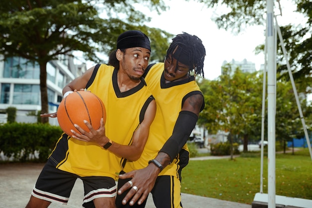Streetball player attacking opponent