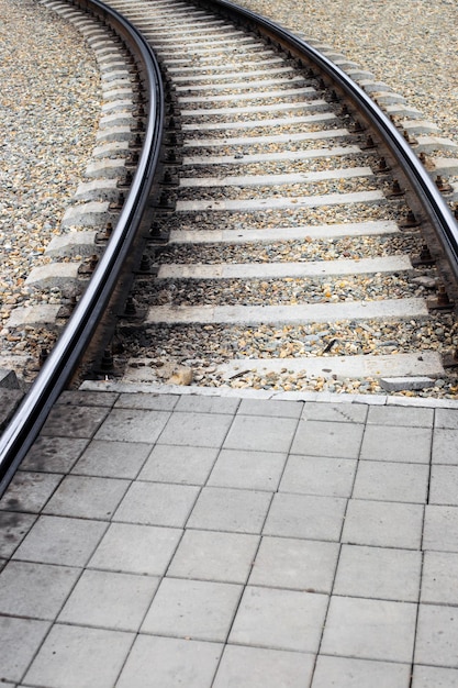 Streetcar line with a platform for pedestrians to cross The rails go into the distance