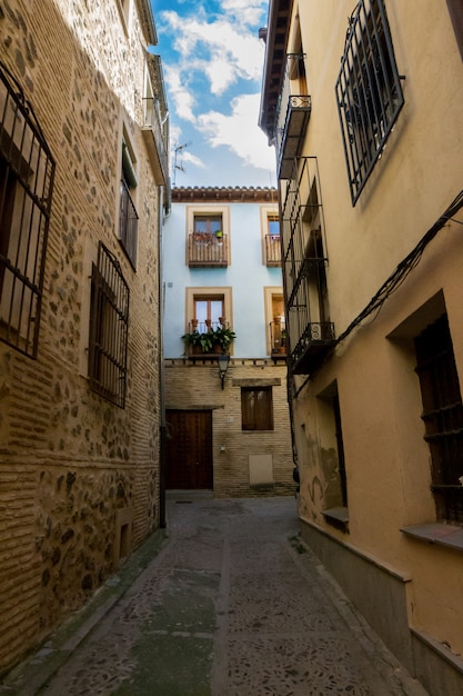 Streets and blue house of the city of Toledo in Spain.