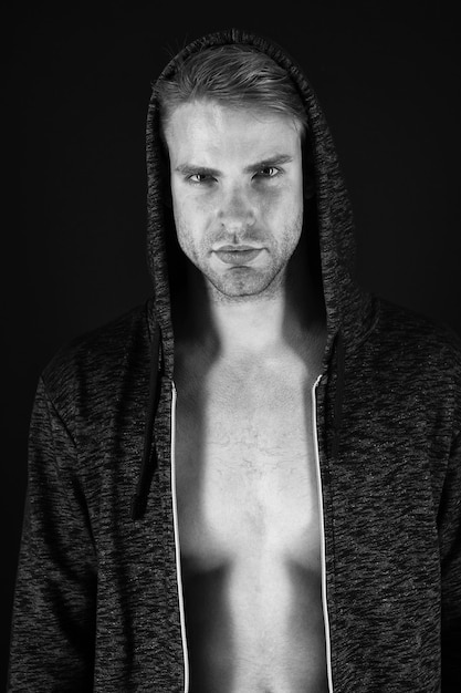 Strength and masculinity Handsome man wearing hoody Muscular man with athletic chest Athletic man with muscular chest Young fit athlete Sexy sportsman Healthy and active lifestyle