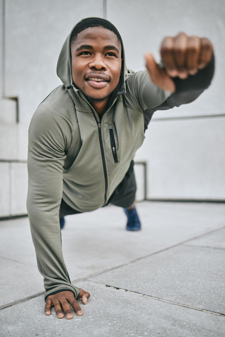 Photo strength training stretching and black man with fitness vision body balance and health goal in the city of canada commitment plank and african athlete on stairs for urban workout and cardio