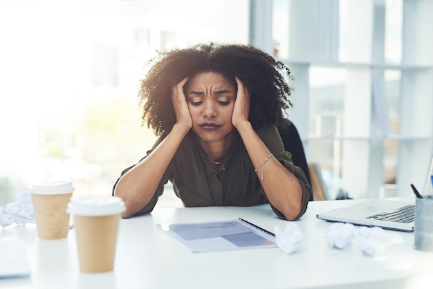 Stress burnout and tired business woman in office with fatigue overworked and exhausted from working Anxiety headache and African female worker overwhelmed for deadline workload and pressure