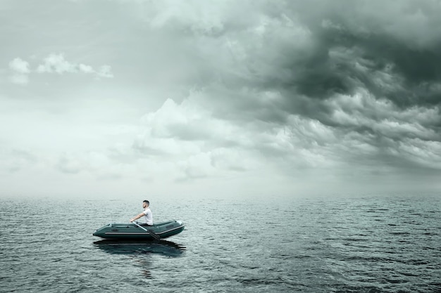 Stress depression emotional burnout Lonely man in a boat in the midst of a gray ocean Pessimism loneliness problems unhappy person Modern design magazine style