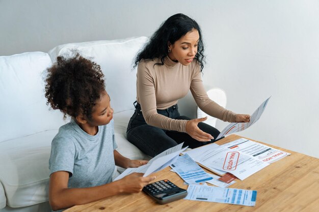 Stressed African American women has financial problems with credit card debt to pay crucial show concept of bad personal money and mortgage pay management crisis