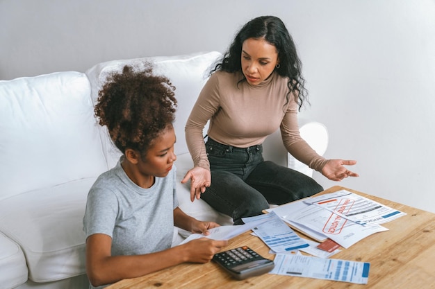 Stressed African American women has financial problems with credit card debt to pay crucial show concept of bad personal money and mortgage pay management crisis