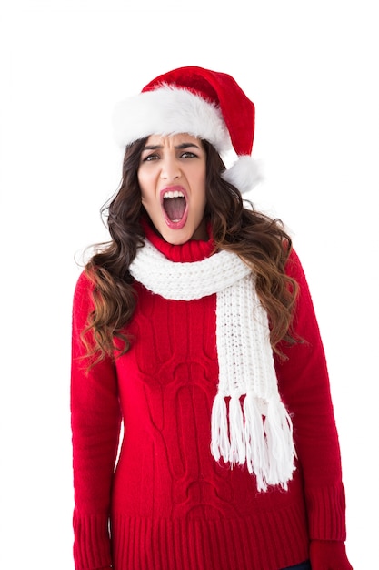 Stressed brunette in santa hat screaming 