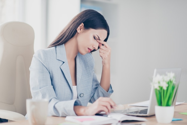 Stressed businesswoman working at desk