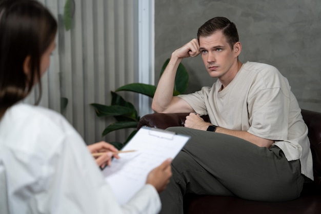 Photo stressed and depressed patient seeking help from psychiatrist unveiling