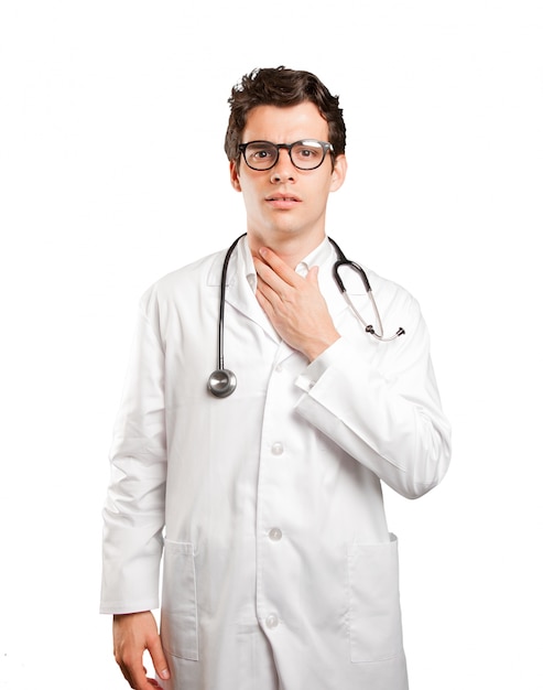 Stressed doctor against white background