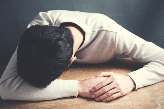 Stressed employee with head on the table