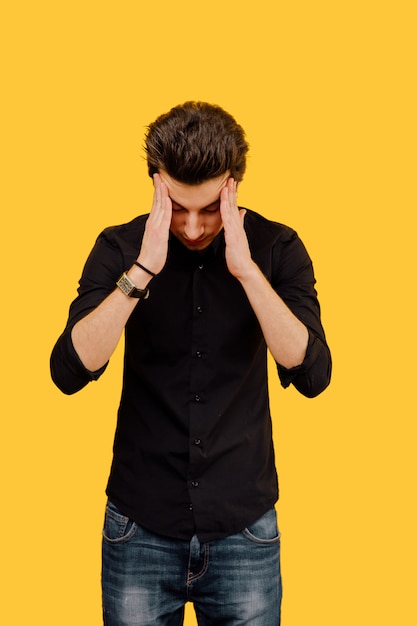 Stressed man with hands on head