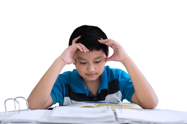 Stressed preteen boy is studying on studio