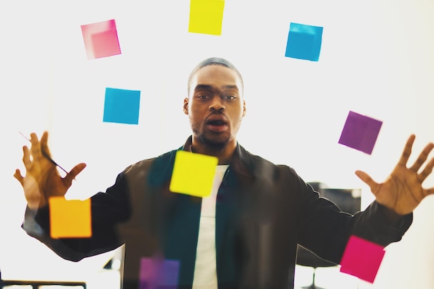 stressed and shocked businessman due to overwork in office