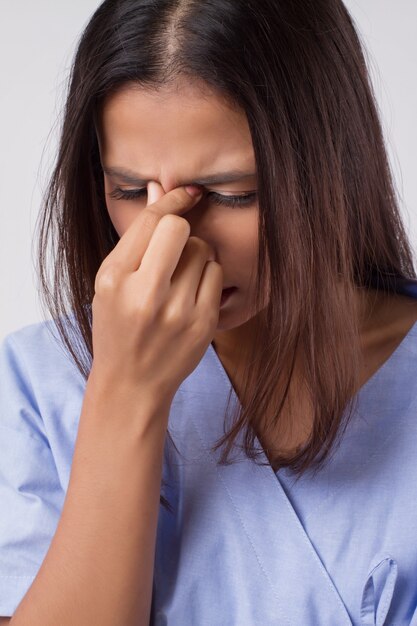 Stressed sick asian woman isolated