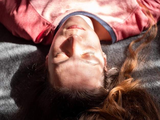 Stressed tired exhausted millennial woman on bed eyes closed suffers from headacheMental health Psychology Low selfesteem Stress Mindfulness Anxiety Depression Emotional burnout Traumatic experience