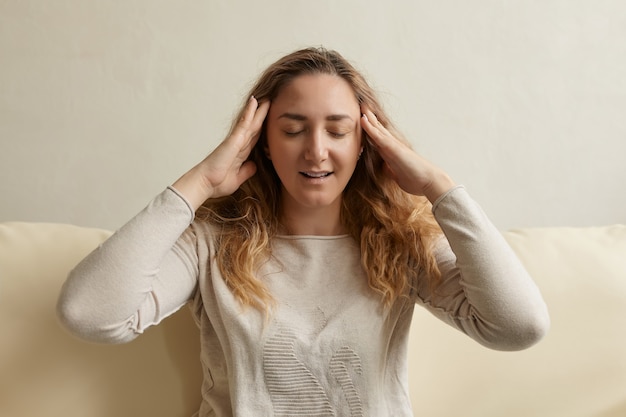 Stressed woman calming down relieving headache emotional stress relief