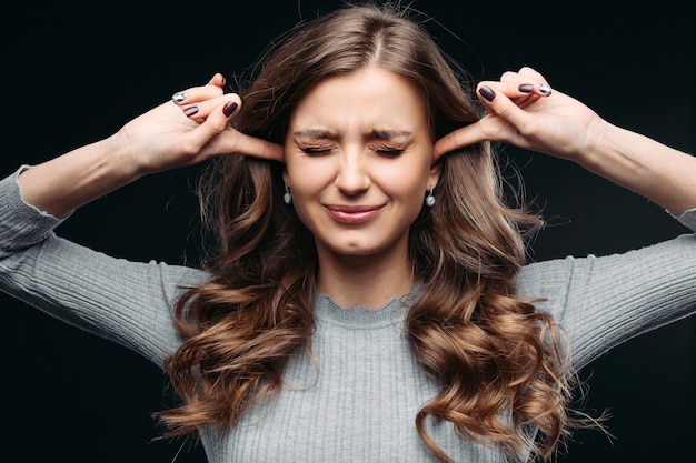 Stressed woman feeling negative emotions Isolated on gray background