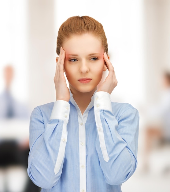 stressed woman holding her head with hands